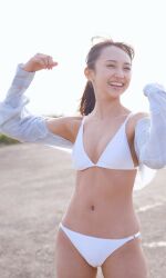 Rule 34 | 1girl, absurdres, arms up, bikini, blurry, blurry background, highres, komiya arisa, looking away, open clothes, open shirt, outdoors, photo (medium), shoes, smile, sneakers, standing, swimsuit, voice actor, white bikini