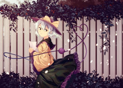 Rule 34 | 1girl, blurry, blurry background, bow, dress, fence, furahata gen, green eyes, green hair, hat, hat bow, highres, holding, holding paper, komeiji koishi, leaf, light particles, long sleeves, one eye closed, paper, short hair, smile, solo, third eye, touhou, wide sleeves, yellow bow
