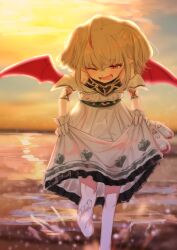 1girl barefoot blush dress dusk gloves grey_hair highres holding holding_footwear holding_unworn_clothes horizon makaino_ririmu makaino_ririmu_(1st_costume) multicolored_hair nijisanji one_eye_closed open_mouth pointy_ears red_eyes red_wings short_hair skirt_hold sky smile solo streaked_hair sunlight toes twilight two-tone_hair utsusumi_kio virtual_youtuber water wings