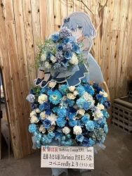 1girl artist_name bang_dream! black_footwear blue_eyes blue_flower blue_hair blush bouquet butterfly_hair_ornament closed_mouth dress flower flower_stand group_name hair_between_eyes hair_ornament holding holding_bouquet kurata_mashiro photo_(medium) shoes short_hair sleeveless sleeveless_dress smile solo translation_request woodonly