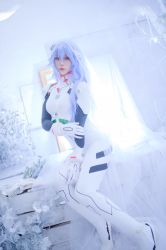 Rule 34 | 1girl, ayanami rei, ayanami rei (cosplay), blue hair, breasts, cosplay, evangelion: 3.0+1.0 thrice upon a time, flower, glico happy, highres, long hair, looking at viewer, neon genesis evangelion, plugsuit, real life, rebuild of evangelion, sitting, tagme, thighs, white background
