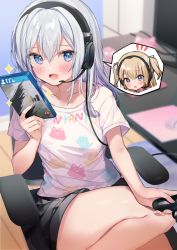 Rule 34 | 2girls, :d, :o, bare legs, black shorts, blonde hair, blue eyes, blush, chair, collarbone, commentary request, controller, game controller, hair between eyes, hand up, headset, highres, holding, holding controller, holding game controller, indoors, kanda done, long hair, multiple girls, notice lines, office chair, on chair, open mouth, original, resident evil, resident evil village, shirt, short shorts, short sleeves, shorts, silver hair, sitting, smile, spoken character, swivel chair, two side up, white shirt
