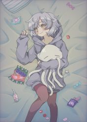 Rule 34 | 1girl, blush, candy, candy wrapper, hugging doll, food, grey hair, grey hoodie, highres, hood, hoodie, konpeitou, lollipop, looking to the side, lying, mashi fish29 (artist), miwa mitsune, hugging object, on back, on bed, orange eyes, pantyhose, smile, solo, squid, stuffed animal, stuffed toy