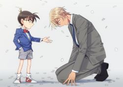 2boys, amuro tooru, bangs, black-framed eyewear, black footwear, blazer, blonde hair, blue neckwear, blurry, bow, bowtie, brown hair, child, closed mouth, collared shirt, commentary request, depth of field, edogawa conan, formal, from side, full body, glasses, grey background, grey jacket, grey pants, grey shorts, grey suit, hair between eyes, hand in pocket, height difference, jacket, k (gear labo), looking at another, looking down, male focus, meitantei conan, multiple boys, necktie, open mouth, outstretched arm, pants, profile, puzzle piece, red bow, red footwear, red neckwear, serious, shadow, shirt, shoes, short hair, shorts, simple background, sneakers, socks, squatting, standing, suit, white legwear, white shirt, wind