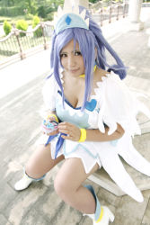 Rule 34 | 1girl, ankle boots, asian, blue eyes, blue hair, boots, bow, bracelet, breasts, cellphone, choker, chouzuki maryou, cleavage, cosplay, cure diamond (cosplay), dokidoki! precure, dress, headpiece, jewelry, large breasts, long hair, magical girl, matching hair/eyes, phone, photo (medium), plump, ponytail, precure, puffy short sleeves, puffy sleeves, ribbon, short sleeves, sitting, solo, tiara