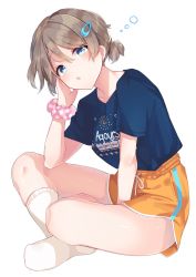 Rule 34 | 1girl, bad id, bad twitter id, blue eyes, blue shirt, brown hair, clothes writing, goroo (eneosu), group name, hair between eyes, highres, indian style, looking at viewer, love live!, love live! sunshine!!, polka dot, polka dot scrunchie, scrunchie, shirt, short hair, shorts, simple background, sitting, socks, solo, song name, watanabe you, white background, white socks, wrist scrunchie, yellow shorts