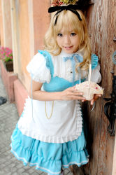 Rule 34 | 1girl, alice (alice in wonderland), alice (alice in wonderland) (cosplay), alice in wonderland, apron, asian, blonde hair, blue eyes, breasts, color contacts, cosplay, hair ribbon, kipi-san, long hair, looking at viewer, mole, outdoors, petite, photo (medium), ribbon, small breasts, smile, solo