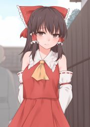 Rule 34 | 1girl, arms behind back, ascot, bare shoulders, black hair, blurry, blurry background, bow, brown eyes, commentary request, day, detached sleeves, frilled bow, frilled shirt collar, frills, hair bow, hair tubes, hakurei reimu, highres, large bow, long hair, looking at viewer, miyo (ranthath), outdoors, red skirt, red vest, skirt, solo, touhou, vest, yellow ascot