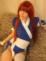 Rule 34 | 1girl, asian, cosplay, couch, curtains, dead or alive, indoors, kasumi (doa), kasumi (doa) (cosplay), long hair, looking at viewer, ninja, pelvic curtain, photo (medium), red hair, saya (cosplayer), sitting, solo, tecmo, thighhighs, white thighhighs