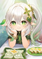 Rule 34 | 1girl, blush, bracelet, closed mouth, elf, food, genshin impact, green eyes, grey eyes, hair between eyes, hair ornament, halva (food), hands on own cheeks, hands on own face, head rest, highres, hitsujino mery, jewelry, looking at viewer, lying, nahida (genshin impact), on stomach, plate, pointy ears, side ponytail, smile, solo, sparkle, symbol-shaped pupils, white hair