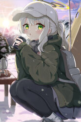 Rule 34 | 1girl, absurdres, backpack, bag, black pantyhose, blue archive, blush, boots, commentary, cup, green eyes, green jacket, grey footwear, grey hair, grey skirt, hair between eyes, halo, hare (blue archive), hare (camp) (blue archive), hat, highres, holding, holding cup, jacket, long hair, long sleeves, looking at viewer, mikumiku37, official alternate costume, outdoors, pantyhose, parted lips, ponytail, revision, skirt, solo, squatting, white hat
