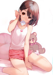 Rule 34 | 1girl, ataruman, bare shoulders, between legs, brown eyes, brown hair, chemise, commentary request, commission, condom, condom in mouth, condom wrapper, hand between legs, head tilt, highres, looking at viewer, mouth hold, original, pink shorts, short hair, short shorts, shorts, sitting, smile, socks, solo, stuffed animal, stuffed toy, teddy bear, white socks