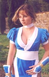 Rule 34 | 1girl, breasts, brown hair, choker, cleavage, cosplay, dead or alive, francesca dani, japanese clothes, kasumi (doa), kasumi (doa) (cosplay), large breasts, medium breasts, mole, mole on breast, outdoors, pelvic curtain, photo (medium), short hair, standing, tecmo, tree