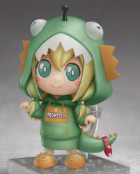1girl, absurdres, amano pikamee, animal hair ornament, artist name, blonde hair, blush stickers, bright pupils, claw pose, commentary, dinosaur costume, dinosaur hood, dinosaur tail, english commentary, figure stand, green eyes, green hair, green hoodie, grey background, hands up, highres, hood, hoodie, looking at viewer, low twintails, multicolored hair, nendoroid, official alternate costume, shiori2525, simple background, slippers, smile, solo, streaked hair, tail, twintails, two-tone hair, voms, white pupils