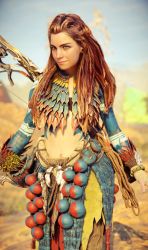 Rule 34 | 1girl, 3d, aloy (horizon), bodypaint, braid, dreadlocks, feet out of frame, female focus, freckles, game console, highres, horizon (video game), horizon forbidden west, horizon zero dawn, long hair, looking at viewer, messy hair, navel, non-web source, outdoors, red hair, smile, solo, tattoo, tribal, tribal tattoo