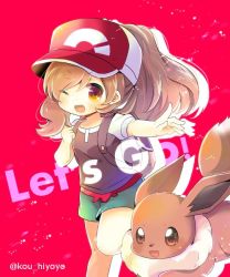 Rule 34 | 1girl, ;d, backpack, bag, baseball cap, blush, breasts, brown eyes, brown hair, brown shirt, clenched hand, commentary request, copyright name, creatures (company), eevee, elaine (pokemon), game freak, gen 1 pokemon, green shorts, hair between eyes, hand up, hat, head tilt, kou hiyoyo, long hair, nintendo, one eye closed, open mouth, outstretched arm, pokemon, pokemon (creature), pokemon lgpe, ponytail, puffy short sleeves, puffy sleeves, red background, red hat, shirt, short shorts, short sleeves, shorts, small breasts, smile, twitter username
