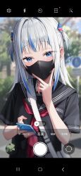 Rule 34 | 1girl, absurdres, alternate costume, bag, black mask, black serafuku, blue eyes, blue hair, blunt bangs, blurry, blurry background, blush, cellphone, day, fake phone screenshot, fake screenshot, gawr gura, green tea (greente42869067), hair ornament, highres, holding, holding phone, hololive, hololive english, looking at viewer, mask, medium hair, mouth mask, multicolored hair, neckerchief, outdoors, phone, red neckerchief, school uniform, serafuku, shark hair ornament, shoulder bag, smartphone, solo, sound effects, streaked hair, two side up, upper body, v over mouth, virtual youtuber, white hair