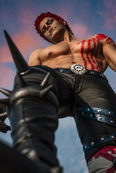 Rule 34 | 1boy, abs, absurdres, arm tattoo, belt, black footwear, black gloves, black pants, blue sky, blurry, boots, charlotte katakuri, chest tattoo, cloud, cosplay photo, depth of field, from below, gloves, highres, looking at viewer, male focus, muscular, muscular male, navel, nipples, one piece, pants, pectorals, photo (medium), pink hair, short hair, skull print, sky, solo, spiked boots, taryn cosplay, tattoo, topless male
