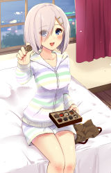 Rule 34 | 1girl, alternate costume, bed, bed sheet, blue eyes, blurry, blush, breasts, chocolate, collarbone, commentary request, curtains, depth of field, eyes visible through hair, hair ornament, hair over one eye, hairclip, hamakaze (kancolle), highres, hood, hood down, hooded jacket, indoors, jacket, kantai collection, large breasts, long sleeves, looking at viewer, on bed, open mouth, pink lips, reaching, reaching towards viewer, sarfata, short hair, silver hair, sitting, solo focus, striped, water, window, wooden floor