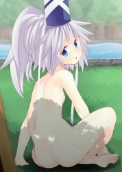 Rule 34 | 1girl, ass, back, barefoot, blue eyes, feet, forest, grass, hat, hat ribbon, indian style, looking at viewer, looking back, mononobe no futo, nature, nigo (aozoragarou), nude, open mouth, ponytail, ribbon, river, shadow, silver hair, sitting, solo, touhou, tree