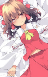 1girl ascot bow breasts brown_hair closed_mouth commentary_request detached_sleeves frilled_bow frilled_hair_tubes frills hair_bow hair_tubes hakurei_reimu head_on_pillow highres long_hair looking_at_viewer lying midriff_peek navel on_back pillow red_bow red_eyes red_skirt skirt skirt_set smile solo tangusuten touhou yellow_ascot