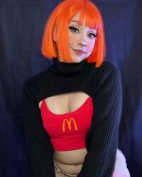 Rule 34 | 1girl, black background, breasts, brown eyes, cleavage, cosplay, female focus, highres, indoors, looking at viewer, mcdonald&#039;s, mexican (nationality), mother (yoru mac), mother (yoru mac) (cosplay), navel, orange hair, photo (medium), short hair, simple background, sitting, small breasts, smile, solo, taliverse, teeth