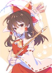 Rule 34 | 1girl, arm up, ascot, bare shoulders, between fingers, blush, bow, brown eyes, brown hair, collarbone, commentary request, detached sleeves, e sdss, frilled bow, frilled hair tubes, frills, gohei, hair bow, hair tubes, hakurei reimu, holding, holding stick, long hair, long sleeves, looking at viewer, nontraditional miko, ofuda, open mouth, paw print, paw print background, red bow, red skirt, red vest, ribbon-trimmed sleeves, ribbon trim, sidelocks, skirt, solo, stick, touhou, vest, wide sleeves, yellow ascot