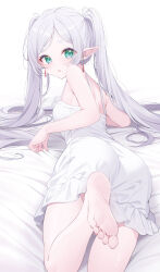Rule 34 | 1girl, ass, barefoot, bed sheet, deyui, dress, earrings, elf, feet, frieren, green eyes, highres, jewelry, long hair, looking at viewer, looking back, lying, on bed, on stomach, open mouth, pointy ears, simple background, sleeveless, soles, solo, sousou no frieren, thick eyebrows, toes, twintails, white background, white dress