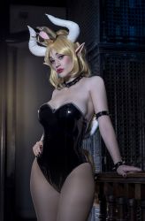 Rule 34 | 1girl, argentine (nationality), armlet, bare legs, bare shoulders, black leotard, blonde hair, bowsette, bowsette (cosplay), bracelet, breasts, cosplay, crown, curvy, hand on own hip, high ponytail, highleg, highleg leotard, highres, horns, jewelry, leotard, lips, long hair, looking at viewer, mario (series), new super mario bros. u deluxe, nintendo, parted lips, photo (medium), solo, sophie valentine, spiked armlet, spiked bracelet, spikes, strapless, strapless leotard, wide hips