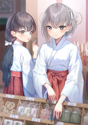 Rule 34 | 2girls, :o, absurdres, black eyes, blurry, blurry background, blush, closed mouth, commentary request, depth of field, fingernails, hair ribbon, highres, holding, japanese clothes, light brown hair, long hair, looking at viewer, looking back, miko, multiple girls, namikishiho, original, ribbon, shop, smile, standing, upper body, white ribbon