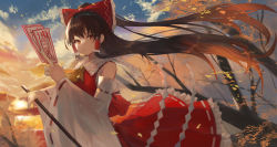 Rule 34 | 1girl, absurdres, bow, brown hair, comic lo, detached sleeves, floating hair, frilled bow, frilled hair tubes, frilled skirt, frills, hair between eyes, hair bow, hair tubes, hakurei reimu, highres, holding, huge filesize, long hair, long skirt, long sleeves, outdoors, red bow, red eyes, red shirt, red skirt, ribbon-trimmed sleeves, ribbon trim, sailor collar, sarashi, shirt, skirt, sleeveless, sleeveless shirt, solo, standing, taht (that is mm), touhou, very long hair, white sailor collar, white sleeves, wide sleeves, yellow neckwear