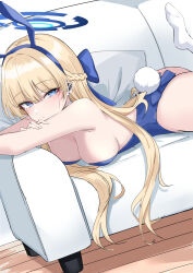 Rule 34 | 1girl, animal ears, ass, blonde hair, blue archive, blue eyes, blue hairband, blue leotard, breasts, closed mouth, couch, earpiece, fake animal ears, hairband, halo, highres, ichiki 1, leotard, long hair, looking at viewer, lying, medium breasts, on couch, on stomach, playboy bunny, rabbit ears, rabbit tail, sideboob, socks, solo, tail, toki (blue archive), toki (bunny) (blue archive), white socks