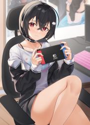 Rule 34 | 1girl, black choker, black hair, black jacket, black shorts, blush, choker, closed mouth, collarbone, crossed bangs, foot out of frame, hair between eyes, hair ornament, highres, holding, indoors, jacket, keyboard (computer), long sleeves, looking at viewer, monitor, nintendo switch, off shoulder, on chair, open clothes, open jacket, original, poster (object), red eyes, shirt, short hair, shorts, sitting, solo, table, tapioka (oekakitapioka), white shirt, wooden floor