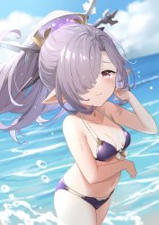 Rule 34 | 1girl, absurdres, bikini, blue sky, breasts, closed mouth, cloud, collarbone, cowboy shot, day, granblue fantasy, hair ornament, hair over one eye, halterneck, halterneck, harvin, highres, iwao (pixiv258710), long hair, looking at viewer, navel, niyon (granblue fantasy), ocean, outdoors, pointy ears, ponytail, purple bikini, purple hair, red eyes, sky, small breasts, solo, summer, swimsuit