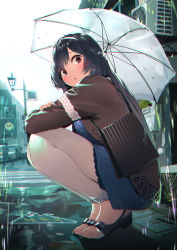 1girl, :o, bag, bangs, black footwear, black hair, blue dress, blush, braid, brown jacket, city, commentary request, dress, fingernails, furukawa itsuse, hairband, highres, holding, holding umbrella, jacket, long hair, long sleeves, looking at viewer, looking to the side, open clothes, open jacket, original, outdoors, pants, rain, red eyes, road, sandals, shoulder bag, sidelocks, solo, squatting, street, toeless footwear, toenails, toes, umbrella, white pants