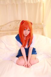 Rule 34 | 1girl, asian, bed, cosplay, highres, neon genesis evangelion, orange hair, photo (medium), souryuu asuka langley (cosplay), tanaka mana