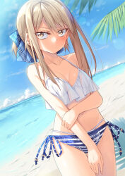 Rule 34 | 1girl, bare shoulders, beach, bikini, blonde hair, blue ribbon, blue sky, blush, bow, breasts, brown eyes, closed mouth, cloud, collarbone, day, hair bow, hair ribbon, highres, ina (inadahime), long hair, looking at viewer, navel, ocean, original, outdoors, ribbon, side-tie bikini bottom, sky, small breasts, solo, standing, striped bikini, striped clothes, swimsuit, white bikini