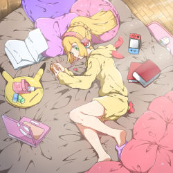 Rule 34 | 1girl, alternate costume, bed, blonde hair, book, closed mouth, computer, creatures (company), game freak, green eyes, headphones, hood, hood down, indoors, laptop, lillie (pokemon), long hair, long sleeves, lying, mifa, nintendo, nintendo switch, on side, open book, pillow, pokemon, pokemon sm, ponytail, shorts, slippers, solo