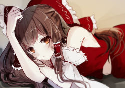 Rule 34 | 1girl, bare shoulders, blurry, bow, brown hair, commentary request, detached sleeves, expressionless, frilled bow, frills, hair bow, hair tubes, hakurei reimu, kisaragi yuri, long hair, looking at viewer, lying, on stomach, orange eyes, pale skin, red shirt, red skirt, shirt, sidelocks, skirt, skirt set, sleeveless, sleeveless shirt, solo, touhou, very long hair, wide sleeves