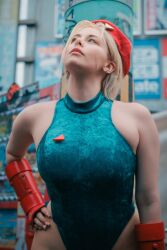 Rule 34 | 1girl, bare legs, bare shoulders, blonde hair, braid, breasts, cammy white, cammy white (cosplay), cosplay, curvy, earrings, fingerless gloves, gloves, hat, highleg, highleg leotard, italian (nationality), jewelry, large breasts, leotard, lips, long hair, looking up, photo (medium), real life, revealing clothes, sleeveless, smile, standing, street fighter, twin braids, very long hair, wide hips, yuriko tiger
