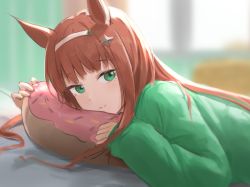 Rule 34 | 1girl, blurry, blurry background, blush, brown hair, character request, closed mouth, depth of field, doughnut-shaped pillow, from side, green eyes, green sweater, hairband, highres, long hair, long sleeves, looking at viewer, looking to the side, lying, on stomach, pillow, sleeves past wrists, smile, solo, sweater, tadano tarako, umamusume, upper body, white hairband