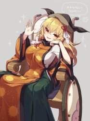 Rule 34 | 1girl, black hat, blonde hair, blush, breasts, chair, constellation print, green skirt, hair between eyes, hat, highres, kozakura (dictionary), large breasts, long hair, matara okina, open mouth, orange sleeves, sitting, skirt, smile, solo, speech bubble, tabard, touhou, translation request, wide sleeves, yellow eyes