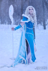 Rule 34 | 1girl, aqua eyes, armor, bare legs, barefoot, blonde hair, blue cloak, blue dress, blue eyes, chain, cloak, cosplay, crystal, crystal maiden, crystal maiden (cosplay), dota (series), dota 2, dress, eyelashes, eyeliner, eyeshadow, forest, fur trim, gloves, highres, knees, legs, lips, long hair, looking at viewer, makeup, nature, nose, outstretched hand, pantyhose, parted lips, photo (medium), self-upload, signature, snow, snowing, solo, staff, standing, winter