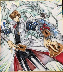 Rule 34 | 1boy, bad id, bad twitter id, black pants, blue-eyes white dragon, blue eyes, bracer, bright pupils, brown hair, card, closed mouth, coat, commentary request, contrapposto, dragon, duel disk, duel monster, hair between eyes, highres, holding, holding card, jewelry, kaiba seto, looking at viewer, male focus, maruchi, necklace, open clothes, open coat, pants, photo (medium), solo, standing, traditional media, white coat, yu-gi-oh!