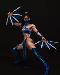 Rule 34 | 1girl, abs, armpits, black background, black eyes, black hair, boots, breasts, cleavage, clothes, cosplay, cosplay photo, fang, fangs, female focus, highres, holding, holding weapon, japanese (nationality), kitana, kitana (cosplay), legs apart, looking at viewer, mask, medium breasts, midriff, model, mortal kombat (series), mouth mask, muscular, muscular arms, muscular female, muscular legs, navel, pelvic curtain, photo (medium), ponytail, real life, simple background, solo, standing, thigh boots, war fan, weapon, yuan herong
