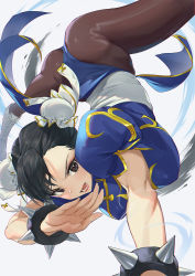 Rule 34 | 1girl, ass, black hair, blue dress, boots, bracelet, brown eyes, brown pantyhose, bun cover, capcom, china dress, chinese clothes, chun-li, cross-laced footwear, double bun, dress, hair bun, handstand, highres, jewelry, mhk (mechamania), one arm handstand, open hand, open mouth, pantyhose, pelvic curtain, puffy short sleeves, puffy sleeves, sash, short sleeves, solo, spiked bracelet, spikes, spinning bird kick, street fighter, thighs, white footwear