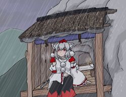 1girl animal_ear_fluff animal_ears arm_on_knee awning bench black_skirt commentary_request detached_sleeves double-parted_bangs feet_out_of_frame grey_hair grey_sky hat highres inubashiri_momiji killerfurball12 light_frown long_skirt long_sleeves looking_afar medium_hair mountain partial_commentary pom_pom_(clothes) rain raised_inner_eyebrows red_eyes red_hat red_ribbon red_skirt ribbon ribbon-trimmed_sleeves ribbon_trim shirt sitting skirt sky solo staring tail tokin_hat touhou two-tone_skirt white_shirt wide_sleeves wolf_ears wolf_girl wolf_tail