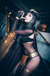 Rule 34 | 1girl, black hair, blunt bangs, bodysuit, cape, circlet, cosplay, finger to mouth, fire emblem, fire emblem awakening, hair ornament, highres, looking at viewer, nintendo, photo (medium), solo, standing, tharja, tharja (cosplay), tharja (fire emblem)