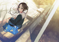 Rule 34 | 1girl, bag, bench, bicycle, black eyes, black serafuku, black shirt, blouse, book, brown hair, commentary request, day, evening, grass, handheld game console, holding, holding book, long sleeves, looking at viewer, looking back, messenger bag, morifumi, open bag, open book, original, outdoors, playstation portable, pleated skirt, sailor collar, school bag, school uniform, serafuku, shadow, shirt, shoulder bag, sitting, skirt, solo
