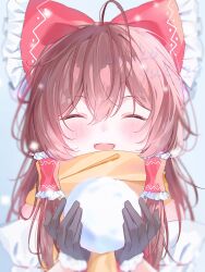 1girl ascot black_gloves bow brown_hair closed_eyes commentary_request facing_viewer frilled_bow frilled_hair_tubes frills gloves hair_bow hair_tubes hakurei_reimu highres holding holding_snowball long_hair nekoyuki29 open_mouth red_bow scarf smile snowball solo touhou twitter_username yellow_ascot yellow_scarf